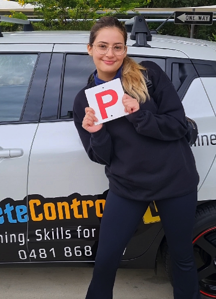 Learner driver celebrating after passing their driving test on the Gold Coast